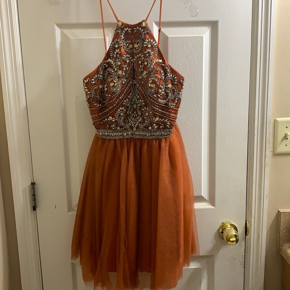 Burnt orange size 0 prom or homecoming dress with sequins over the top area
